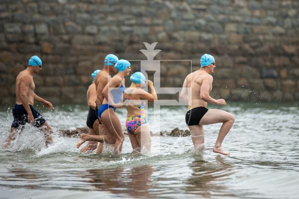 Picture by Karl Dorfner. 01-09-2024 - Havelet Regatta - The swimmers entering the sea for the race around havelet bay