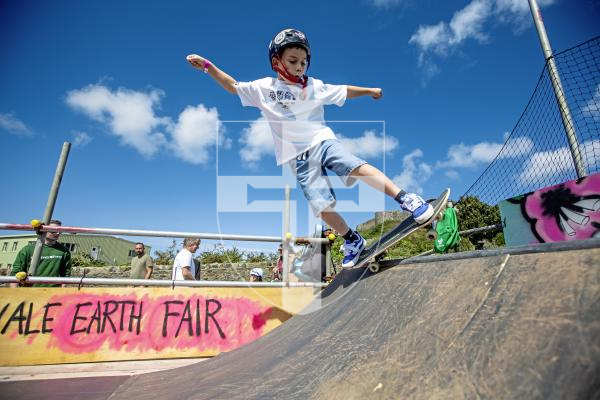 Picture by Peter Frankland. 23-08-24 The Vale Earth Fair 2024. Ted Machon, 8 on the skateboard ramp which had been set up on the hill outside the castle.