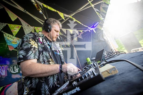 Picture by Peter Frankland. 23-08-24 The Vale Earth Fair 2024. 'G' of Coastal Connections (Gareth Pennington) doing a DJ set in the dance tent.