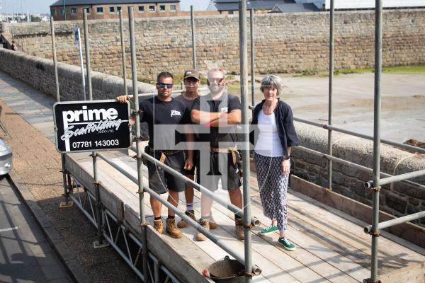 Photo by Erin Vaudin. 30.08.24. From left to right, Frank Le Tissier, Corey Greening, James Marquis and Odette Duerden, Havelet Regatta Committee member. Prime Scaffolding are installing a ramp for wheelchair users at the Havelet Regatta.