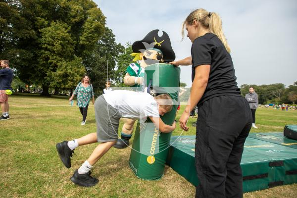 Picture by Karl Dorfner. 31-08-2024 - The Sauzmarez Park Sports Day Event - Mark Jenner (9) in mid tackle at the rugby tackling practice section