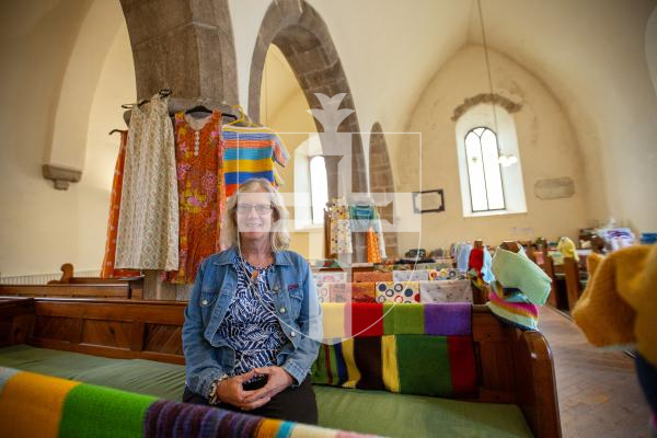 Picture by Karl Dorfner 31-08-2024 - Linda Archard at Forest Church Tumaini fundraiser service. Showing the colourful blankets that have been knitted by parishioners for donation to charity