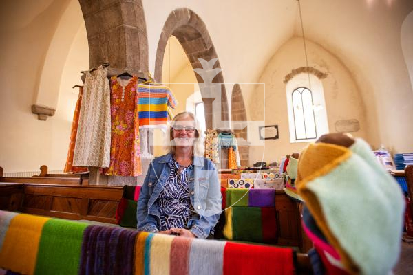 Picture by Karl Dorfner 31-08-2024 - Linda Archard at Forest Church Tumaini fundraiser service. Showing the colourful blankets that have been knitted by parishioners for donation to charity