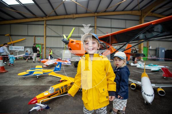 Picture by Karl Dorfner. 01-09-2024 - Aero Club Wings and Wheels Event - Felix (2) and brother Casper Barlow (4) getting close to some of the model airplanes at the event