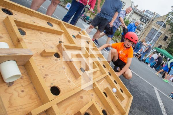 Picture by Karl Dorfner. 01-09-2024 - Havelet Regatta - Daniel Willis (8) playing on the balance game where you have to guide a ball through a maze without it fallling in the holes