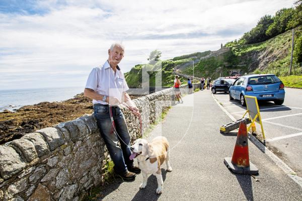 Picture by Sophie Rabey.  06-09-24.  Environment & Infrastructure have reopened the steps from La Vallette to Clarence Battery following the completion of work to stabilise the rock faces and reinstate the steps.
Peter Wilson and his dog Ricket live nearby and used to walk this route, he was going to go up the steps today once reopening.