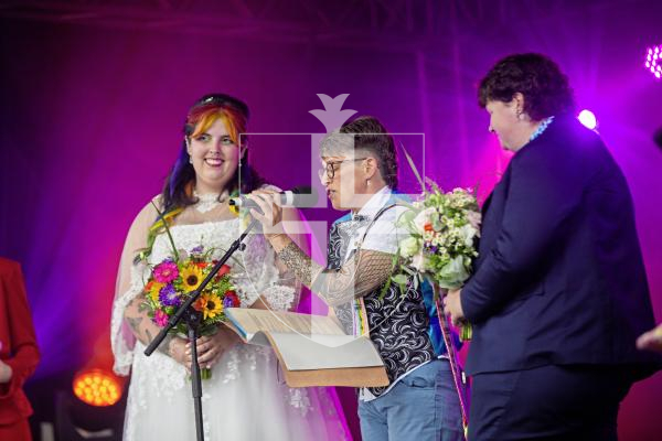 Picture by Sophie Rabey.  07-09-24.  Channel Island Pride 2024 celebrations in St Peter Port Town.
Becca Morris and Freddy Palmer got married on the main stage in Market Square in what is believed to be the first-ever marriage at Pride.  Ellie Jones (CEO of Liberate), also a wedding celebrant, married them today.