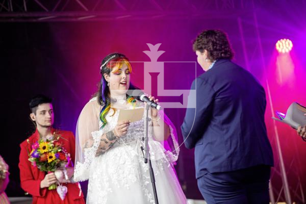 Picture by Sophie Rabey.  07-09-24.  Channel Island Pride 2024 celebrations in St Peter Port Town.
Becca Morris and Freddy Palmer got married on the main stage in Market Square in what is believed to be the first-ever marriage at Pride.  Ellie Jones (CEO of Liberate), also a wedding celebrant, married them today.