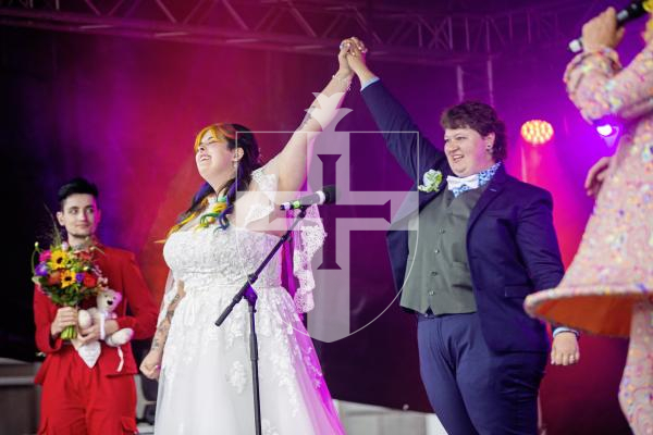 Picture by Sophie Rabey.  07-09-24.  Channel Island Pride 2024 celebrations in St Peter Port Town.
Becca Morris and Freddy Palmer got married on the main stage in Market Square in what is believed to be the first-ever marriage at Pride.  Ellie Jones (CEO of Liberate), also a wedding celebrant, married them today.