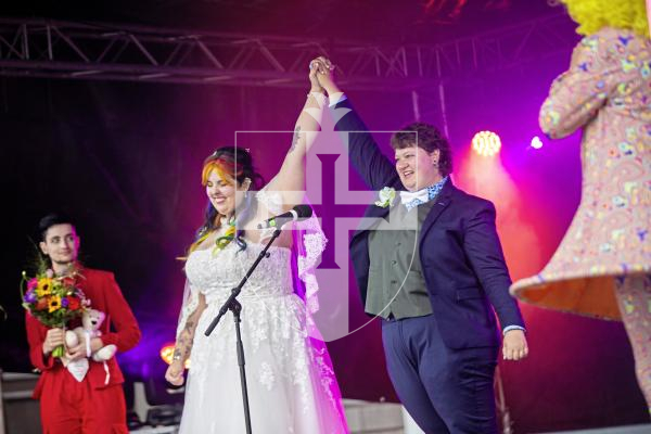 Picture by Sophie Rabey.  07-09-24.  Channel Island Pride 2024 celebrations in St Peter Port Town.
Becca Morris and Freddy Palmer got married on the main stage in Market Square in what is believed to be the first-ever marriage at Pride.  Ellie Jones (CEO of Liberate), also a wedding celebrant, married them today.