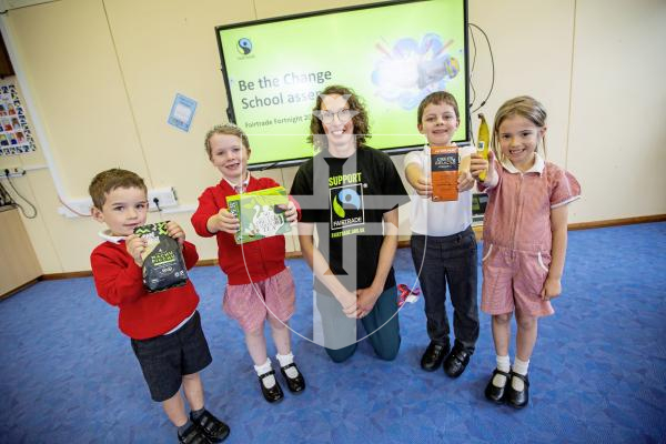 Picture by Sophie Rabey.  09-09-24.  Hannah Davis from  Fairtrade Guernsey visited Vale Primary School today to hold an assembly on Fairtrade.  It is the start of Fairtrade fortnight and they are celebrating 30 years of being on the shelves.
L-R Leo Cunningham (5), Ciara Mitchell (5), Hannah Davis, Bailey Mallandaine (6) and Beau Masterton (6).