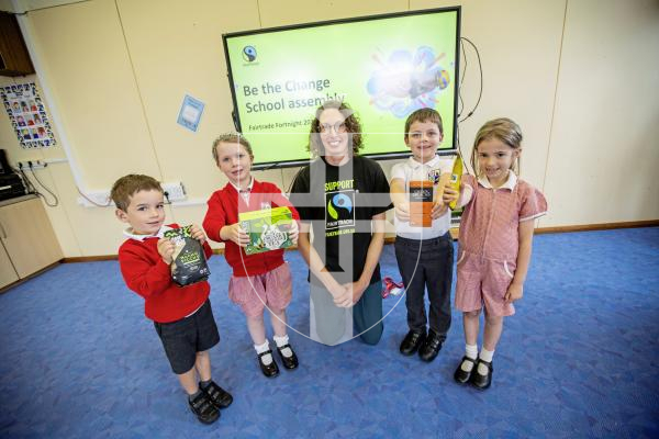 Picture by Sophie Rabey.  09-09-24.  Hannah Davis from  Fairtrade Guernsey visited Vale Primary School today to hold an assembly on Fairtrade.  It is the start of Fairtrade fortnight and they are celebrating 30 years of being on the shelves.
L-R Leo Cunningham (5), Ciara Mitchell (5), Hannah Davis, Bailey Mallandaine (6) and Beau Masterton (6).