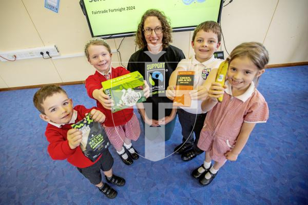 Picture by Sophie Rabey.  09-09-24.  Hannah Davis from  Fairtrade Guernsey visited Vale Primary School today to hold an assembly on Fairtrade.  It is the start of Fairtrade fortnight and they are celebrating 30 years of being on the shelves.
L-R Leo Cunningham (5), Ciara Mitchell (5), Hannah Davis, Bailey Mallandaine (6) and Beau Masterton (6).