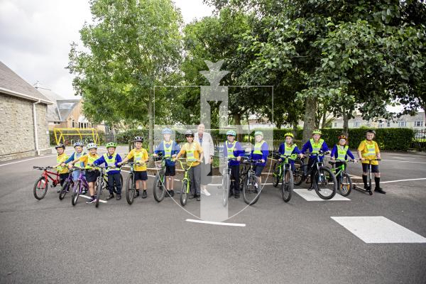 Picture by Sophie Rabey.  11-09-24.  St Martins Primary School now have 91% of students arriving at school via Active Travel and are very happy with the results.
Headteacher Clare Giles with children from years 1, 2 and 6 with their bikes.