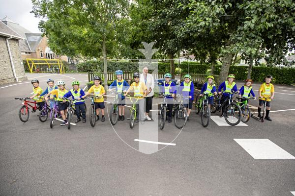 Picture by Sophie Rabey.  11-09-24.  St Martins Primary School now have 91% of students arriving at school via Active Travel and are very happy with the results.
Headteacher Clare Giles with children from years 1, 2 and 6 with their bikes.