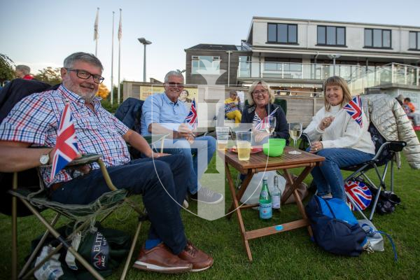 Picture by Karl Dorfner - KGV - Proms on the wicket event - Charlie Cottam, Martyn Torrode,  Kay Cottam and  Shani Torrode at their picnic table with flags watching the event