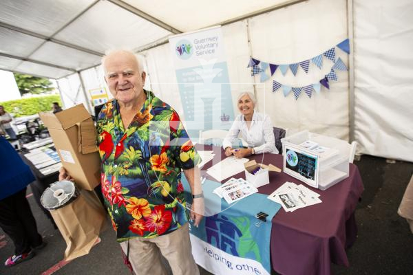 Picture by Sophie Rabey.  16-09-24.  Housing 21 along with Rosaire Community Association, Health Connections and other local charities, organisations and States Departments held Guernseys first 'Celebrating Age Festival'.  It is targeted at over 55s and hopes to become an annual event.  There were a lot of stalls available for people to go and see and get information from.
Barry Sansom (82) talking with Denise Cohu from Guernsey Voluntary Service.