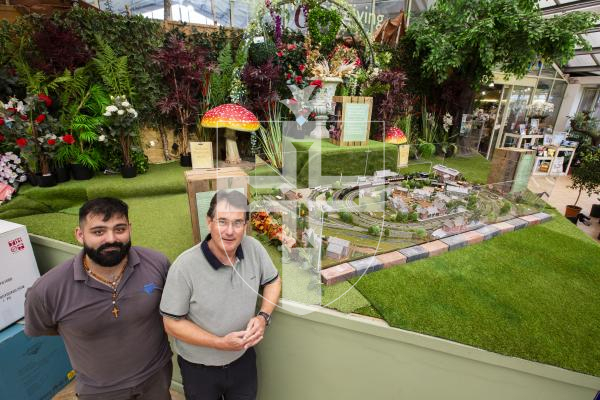 Picture by Sophie Rabey.  05-09-24.  Paul Foster completed a lockdown project of finishing a railway set that was purchased by his late father who never made it.  The set is on display at Le Friquet Garden Centre and will be going up for auction to raise money for the charity Young Lives vs Cancer.
L-R Shane Gouveia (Supervisor for Furniture & Christmas at Le Friquet) and Paul Foster.