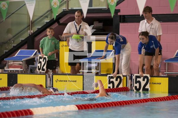 Picture by Peter Frankland. 27-09-24 Swimming at St Sampson's High School. The Wayfarers Travel Island Championships 2024. Sisters L-R - Elodie Riley and Delphine Riley compete in the 1500m. L-R - Jemima Green and Molly Staples are doing the number boards.