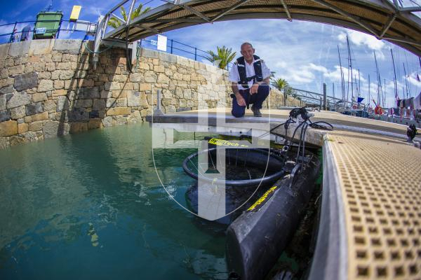 Picture by Peter Frankland. 23-08-24 Launch of the first 'PortBin'. Hugo the Harbour Hoover was named by 8 year old Olivia Bishop and paid for by Rotary Guernesiais. Steve Lowe is the Marina Manager at Guernsey Ports.