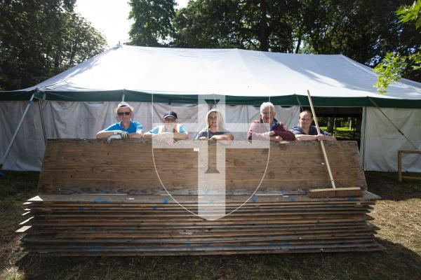 Picture by Peter Frankland. 23-08-24 The North Show tents, tables and stalls are being taken down. L-R - Barry Carre, John Ozanne, Ally De Carteret, Ken Falla and Leah Peck. Clearing the fur and feather tables away.