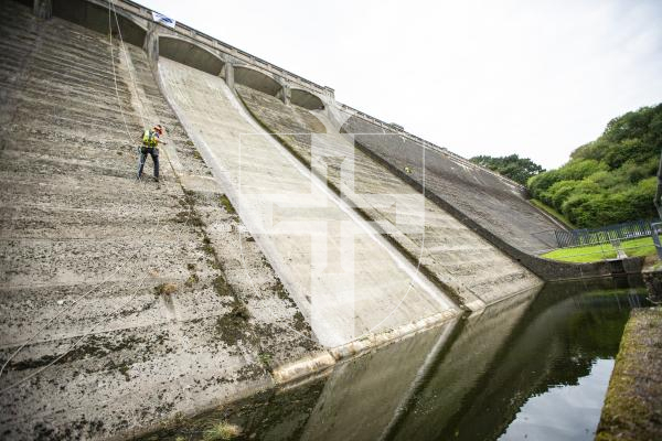 Picture by Sophie Rabey.  04-09-24.   Geomarine have started work on clearing the dam wall of St Saviours Reservoir, removing the weeds and debris that has built up over the last few years.
Lewis Battle and John White.