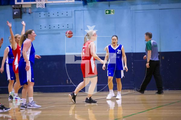 Picture by Peter Frankland. 22-11-23 Basketball at Beau Sejour. Comets v Diamonds. Players react after comets player (Number 9 - 2nd from right) scored a three pointer from just over the halfway line on the buzzer.