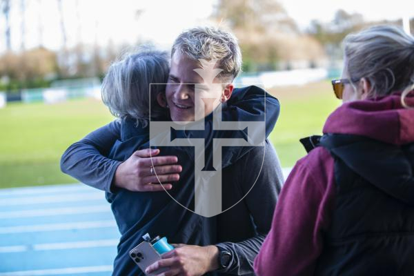 Picture by Peter Frankland. 27-11-23 Drew Jonkmans has completed a 24hr run around Footes Lane. Raising money for Guernsey Mind. Greeting friends and family afterwards.