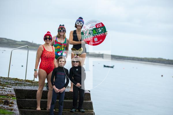 Picture by Luke Le Prevost. 29-11-23.
Preview for Les Bourgs Hospice 12 Bays of Christmas fundraiser launching on the 1st December, pictured at Rousse Pier. L-R Back row: Kerry Marley, Dawn Sealey and Liz Stonebridge (fundraising administrator). Front row: Jude Marley (9) and Jack Sealey (10)