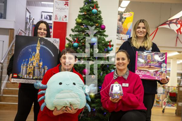 Picture by Luke Le Prevost. 30-11-23.
Aladdin's Cave with some of the most popular toys selling this Christmas.  L-R sales assistant Maddi Collenette with Lego Disney, sales assistant Amanda Vidamour with Squishmallows, operations director Natalie Maides with Bitzee and sales assistant Ruby Palmeri with Barbie