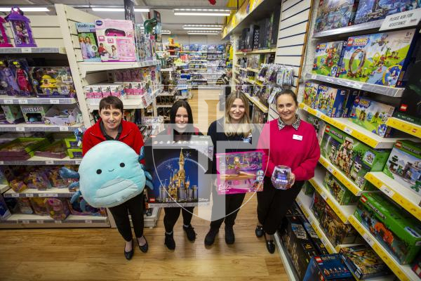 Picture by Luke Le Prevost. 30-11-23.
Aladdin's Cave with some of the most popular toys selling this Christmas.  L-R sales assistant Amanda Vidamour with Squishmallows, sales assistant Maddi Collenette with Lego Disney, sales assistant Ruby Palmeri with Barbie and operations director Natalie Maides with Bitzee