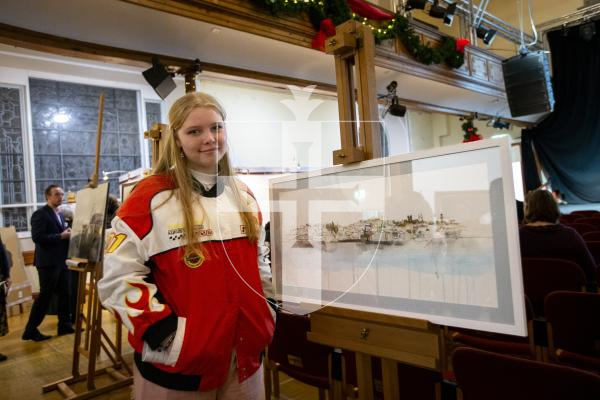 Picture by Luke Le Prevost. 29-11-23.
Sovereign Art Foundation Students Prize exhibition, auction and awards at St James. Genevieve Swainston (16) with 'Guernsey Seafront'