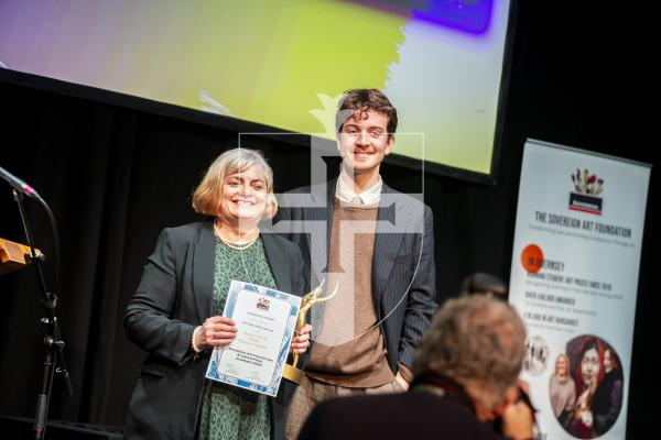 Picture by Luke Le Prevost. 29-11-23.
Sovereign Art Foundation Students Prize exhibition, auction and awards at St James. L-R Miss Elizabeth Bridge (Ladies College vice-principal) collecting awards on behalf of winners Cait Le Noury and Lily Parkes, presented by Matt Graysmith, 2020-2023 SAF bursary student