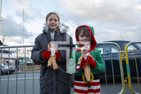 Picture by Luke Le Prevost. 01-12-23.
Santa Claus arrived at the Bridge in a fire engine to switch on the Christmas Lights. L-R Faye (11) and Amy (6) Austin