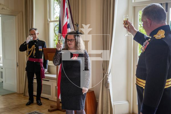 Picture by Luke Le Prevost. 02-12-23.
Investiture of Lucy Beere who received her MBE, by the Lieutenent Governor at Government House, for her sporting achievements. L-R Major Marco Ciotti, Lucy Beere and Lt Governor Richard Cripwell