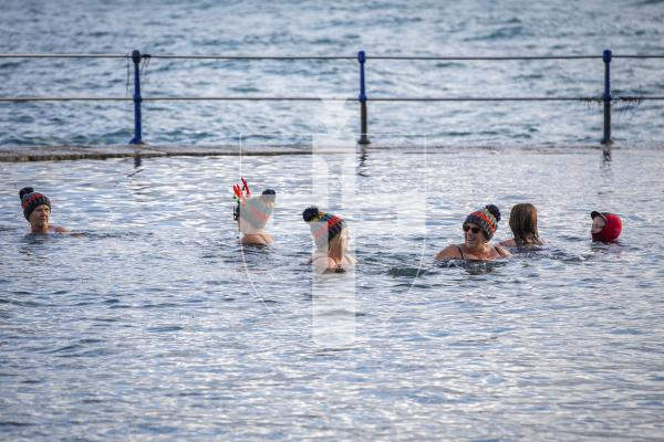 Picture by Luke Le Prevost. 02-12-23.
Swimmers gathered at La Valette Bathing Pools to take part in 12 Bays for Christmas, raising money for Les Bourgs Hospice.