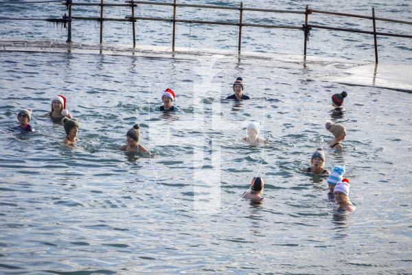Picture by Luke Le Prevost. 02-12-23.
Swimmers gathered at La Valette Bathing Pools to take part in 12 Bays for Christmas, raising money for Les Bourgs Hospice.