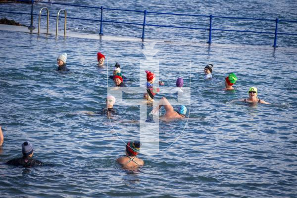 Picture by Luke Le Prevost. 02-12-23.
Swimmers gathered at La Valette Bathing Pools to take part in 12 Bays for Christmas, raising money for Les Bourgs Hospice. Swim All Seasons