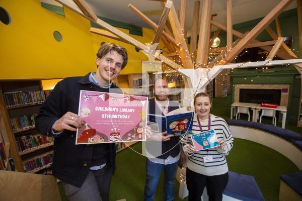 Picture by Luke Le Prevost. 05-12-23.
Guille-Alles' children's library is celebrating it's 5th birthday. There will be a special event to celebrate with activities for children on Saturday. L-R library assistant, young people services member and poster designer Adam Chilvers, children's team member Neil Torode and head of children and young people services Jodie Hearn.