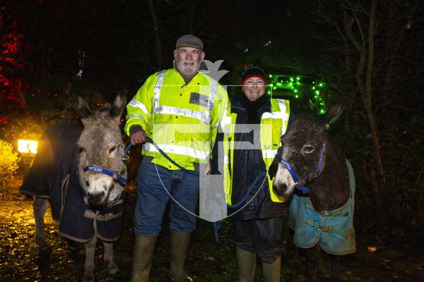 Picture by Luke Le Prevost. 06-12-23.
Winter Wonderland 2023 hosted at the Bachmann's home Les Ruettes Cottage, St Saviours. The event is sponsored by Specsavers, and raises money for the Lions Club of Guernsey and Autism Guernsey. L-R Rodney and Tracy Dyke bought donkeys Matilda and Martha to display