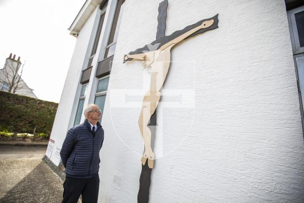 Picture by Sophie Rabey.  28-03-24.  Major Andrew Diaper-Clausen with the wooden cross that the Salvation Army Jigsaw Group have made to put out on the building over Easter.