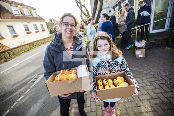Picture by Sophie Rabey.  29-03-24.  Good Friday at Senners Bakery, lots of people collecting hot cross buns.Danielle Hann and her daughter Naomi (8).