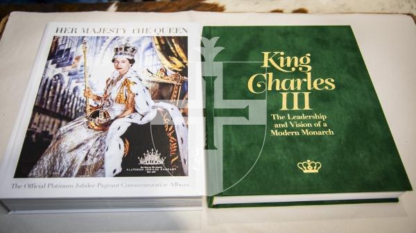Picture by Sophie Rabey.  04-04-24.  Nick Martel has two Royal family books, the Queen's platinum jubilee commemorative album and the King's coronation/ 75th birthday commemorative album.  He will be donating both to the Priaulx Library.