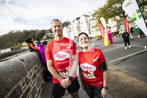 Picture by Sophie Rabey.  14-04-24.  Sure Guernsey Marathon 2024.
Steve Domaille and Sonia Guille (2/4) running as part of the Ambulance & Rescue relay team.