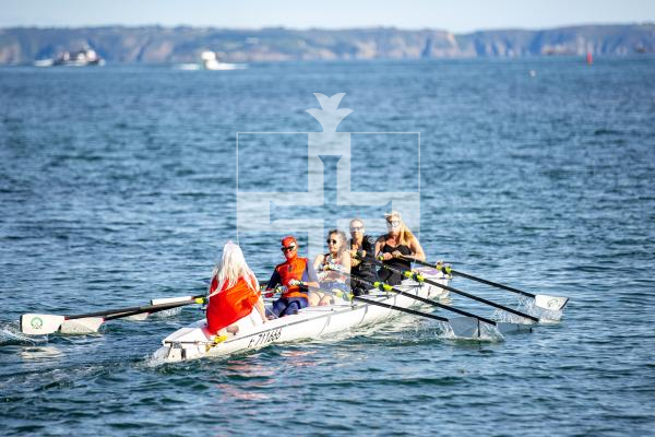 Picture by Karl Dorfner. 14-09-2024 - Pictures from the Belle Greve Bay Rowing race, where some teams raced in fancy dress, featuring a smurf team, super heros, and last years winners dressed as ice cream cones which involved using duvets for the ice cream!