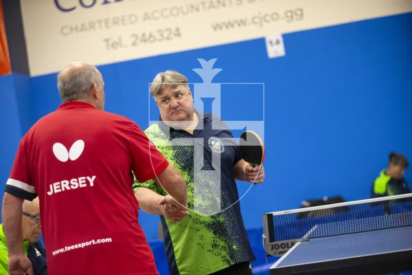 Picture by Peter Frankland. 13-09-24 Table Tennis - Veterans Home Nations 2024 Championships. O60s player Tim Le Page shakes hand with his Jersey opponent.