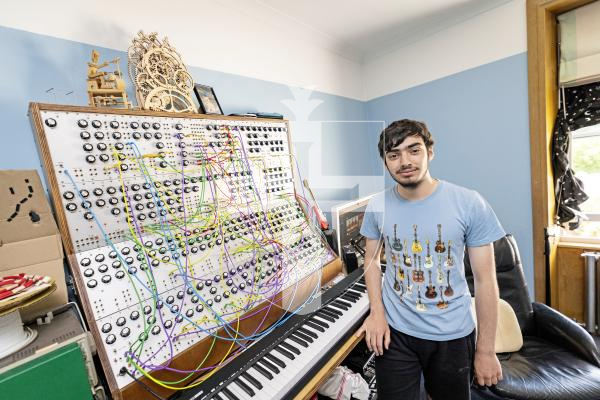 Picture by Sophie Rabey.  23-07-25.  Owen Fraser has been building an analogue synthesiser in his bedroom for two years.  He made most of it from scratch, the wooden frame, power supply and all the circuits, which he soldered himself.