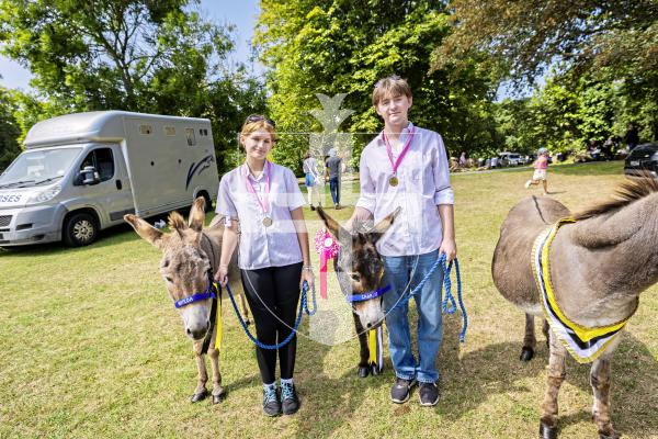 Picture by Sophie Rabey.  24-07-25.  The Royal Guernsey Agricultural Show at Saumarez Park.
Donkeys from the show, Matilda (with Charis Burgoine (15) and Charlie (with Nico Branquet).