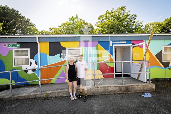 Picture by Sophie Rabey.  24-07-25.  Lydia and Ryan Dawe have been painting, with the help of volunteers, the cabins at LMDC ahead of students coming back in September.