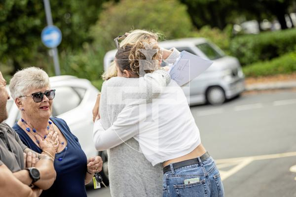 Sophie Rabey.  21-08-25.  GCSE results day.  Les Varendes High School.
Florence Hemery (16) with her family.